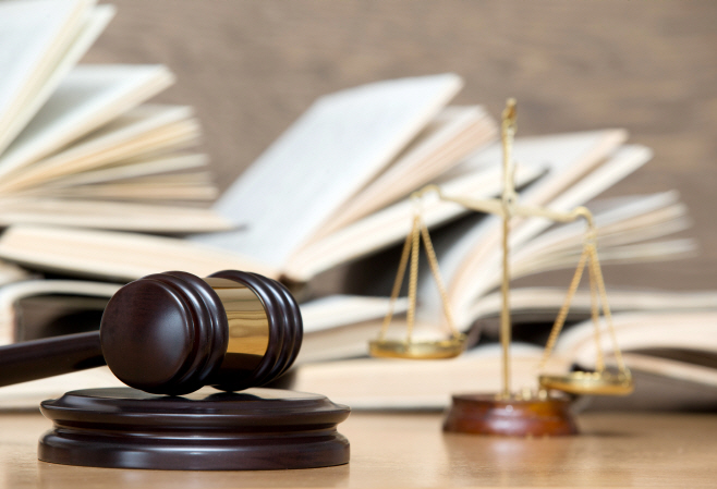wooden gavel and books
