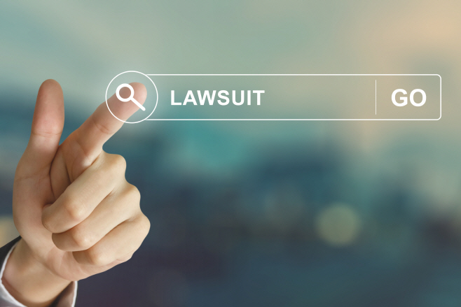 business hand clicking lawsuit button on search toolbar