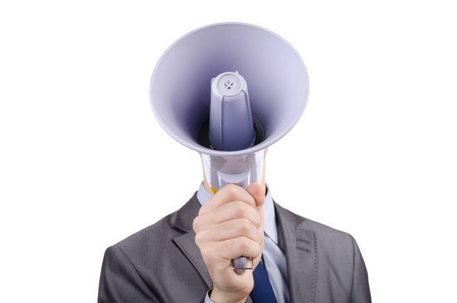 Man shouting and yelling with loudspeaker