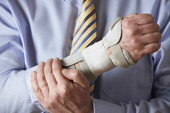 Businessman Suffering With Repetitive Strain Injury
