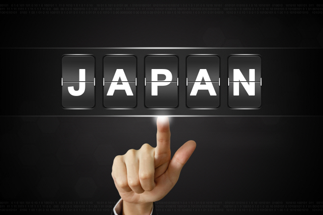 business hand clicking JAPAN on Flipboard