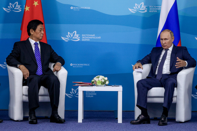 Russia's President Putin and China's National People's Congress Standing Committee Chairman Li meet in Vladivostok