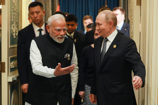 Russia's President Putin and India's PM Modi meet in Tianjin, China