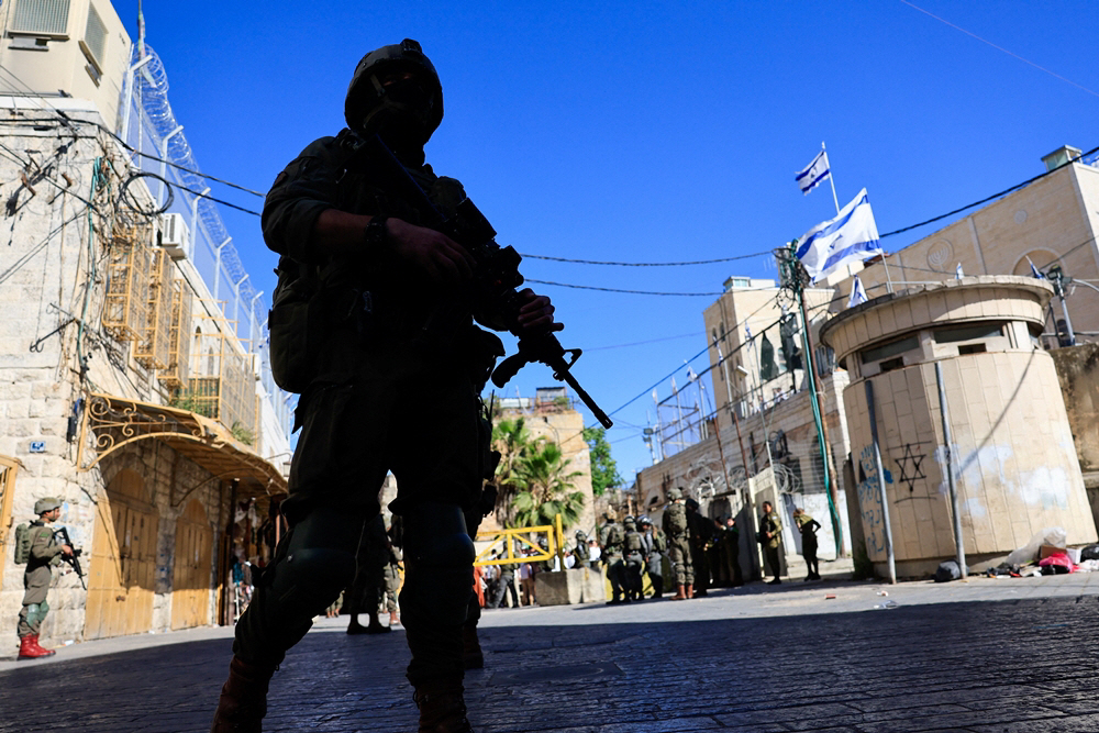 ISRAEL-PALESTINIANS/HEBRON-SETTLERS <YONHAP NO-7343> (REUTERS)